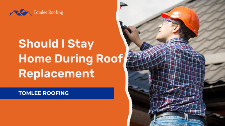 Roofer wearing safety helmet working on roof tiles during replacement – Tomlee Roofing promotional banner with text asking should I stay home during roof replacement.