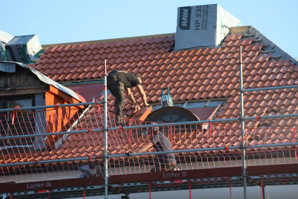 A person preparing for home roof installation