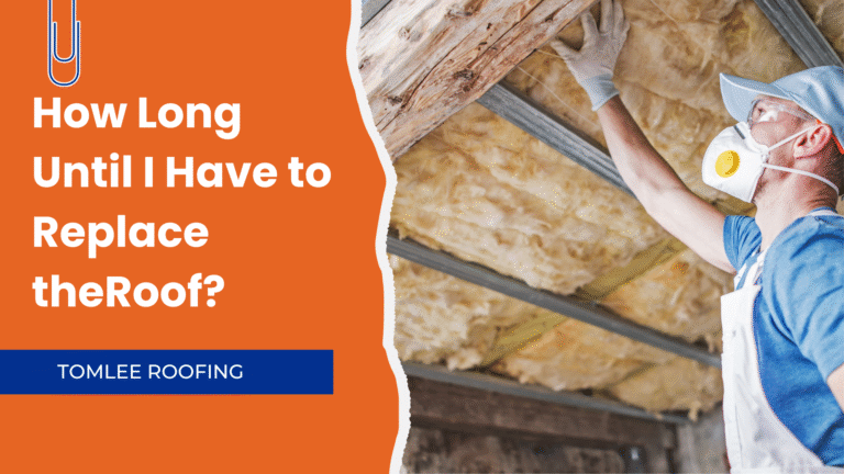 Construction worker in protective gear inspecting roof insulation in an attic space.